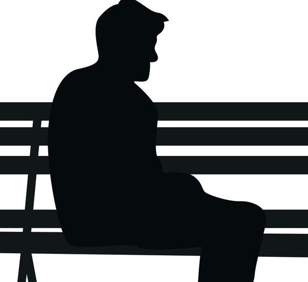 The man sit in park silhouette